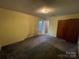 Bedroom featuring closet, window, and access to the hallway at 729 Aintree Rd, Charlotte, NC 28215