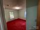 Cozy bedroom featuring bright windows and a red carpet at 729 Aintree Rd, Charlotte, NC 28215