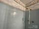 Shower with tiling and shower head at 729 Aintree Rd, Charlotte, NC 28215