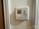 Close-up of a vintage Kirkland thermostat, showing the Air Conditioning & Heating System control at 729 Aintree Rd, Charlotte, NC 28215