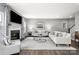 Bright living room with a fireplace, hardwood floors, and stylish furniture at 7349 Childress Sw Dr, Concord, NC 28025