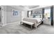 Spacious main bedroom featuring soft carpet, a tray ceiling, and large windows at 7349 Childress Sw Dr, Concord, NC 28025