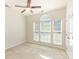 Bright bedroom with carpet, ceiling fan, and windows, offering ample natural light at 740 Rosegate Dr, Gastonia, NC 28056