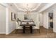 A staged dining room featuring decorative moldings and a chandelier at 740 Rosegate Dr, Gastonia, NC 28056