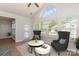 Bright living room featuring vaulted ceilings, lots of natural light, wood-look floors, and stylish furniture at 740 Rosegate Dr, Gastonia, NC 28056