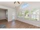 Bright living room featuring vaulted ceilings, lots of natural light, and wood-look floors at 740 Rosegate Dr, Gastonia, NC 28056