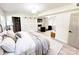 Bright bedroom with a fireplace, closet, neutral decor, and a cozy sitting area at 7507 Limerick Dr, Charlotte, NC 28270