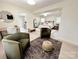 Bright bedroom with an ensuite bathroom, light wood floors, and comfortable seating area at 7507 Limerick Dr, Charlotte, NC 28270