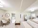 Spacious bedroom with light wood floors, a workstation, and an ensuite bathroom with a glass shower at 7507 Limerick Dr, Charlotte, NC 28270