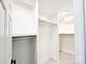 Bright, white walk-in closet with ample shelving and hanging space at 7507 Limerick Dr, Charlotte, NC 28270