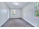 Comfortable bedroom with neutral carpet, freshly painted walls, and sunny view at 805 32Nd Street Ne Dr, Conover, NC 28613