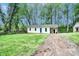 Quaint single-story home featuring fresh exterior paint, a bright blue door, and spacious front yard at 805 32Nd Street Ne Dr, Conover, NC 28613