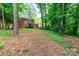 Brick home with spacious lawn, lovely landscaping, and a wood deck at 8807 Tree Haven Dr, Charlotte, NC 28270