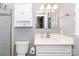Bright bathroom featuring a walk-in shower, white vanity, and modern fixtures at 8807 Tree Haven Dr, Charlotte, NC 28270