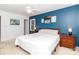 Comfortable bedroom with a ceiling fan, plenty of natural light, and a cozy atmosphere at 8807 Tree Haven Dr, Charlotte, NC 28270