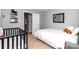 Light-filled bedroom featuring a crib, twin bed, and playful decor at 8807 Tree Haven Dr, Charlotte, NC 28270