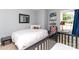 Bright bedroom offering a large bed with decorative pillows and a cozy chair at 8807 Tree Haven Dr, Charlotte, NC 28270