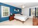 Spacious bedroom with ample natural light, neutral carpet, and stylish accent wall at 8807 Tree Haven Dr, Charlotte, NC 28270