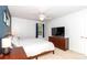 Bedroom featuring neutral tones, TV, ceiling fan and good natural lighting at 8807 Tree Haven Dr, Charlotte, NC 28270
