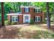 Charming two-story brick home with black shutters and well-manicured landscaping at 8807 Tree Haven Dr, Charlotte, NC 28270