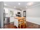 Updated kitchen featuring white cabinets, stainless steel appliances, and a butcher block island at 8807 Tree Haven Dr, Charlotte, NC 28270