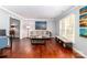 Spacious living room with hardwood floors and ample natural light at 8807 Tree Haven Dr, Charlotte, NC 28270
