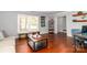 Comfortable living room featuring hardwood floors and contemporary decor at 8807 Tree Haven Dr, Charlotte, NC 28270