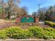 Beautiful Sardis Forest community entrance sign with lush landscaping and well-maintained greenery at 8807 Tree Haven Dr, Charlotte, NC 28270