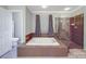 This bathroom features a built-in tub with tile surround and a glass-enclosed shower at 9001 Fenwick Dr, Indian Trail, NC 28079