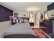 Bedroom with a modern bed frame, decorative wall art, and neutral color scheme at 9001 Fenwick Dr, Indian Trail, NC 28079