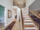 Inviting foyer with hardwood floors, elegant staircase, and plenty of natural light at 9001 Fenwick Dr, Indian Trail, NC 28079