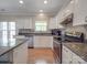 Bright kitchen with stainless steel appliances and granite countertops at 9001 Fenwick Dr, Indian Trail, NC 28079