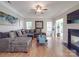 Comfortable living room with fireplace, large windows, and stylish decor at 9001 Fenwick Dr, Indian Trail, NC 28079