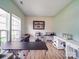 Home office with large windows, ample natural light, and laminate floors at 9001 Fenwick Dr, Indian Trail, NC 28079