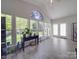Cozy sunroom featuring tile floors, many windows, and access to the outdoor space at 9001 Fenwick Dr, Indian Trail, NC 28079