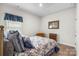 Cozy bedroom with comfortable bed, window with curtains, and carpet flooring at 9077 Myrna Dr, Gastonia, NC 28056