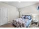 This carpeted bedroom features neutral paint, ample natural light, and a ceiling light at 9077 Myrna Dr, Gastonia, NC 28056