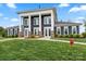 A stately clubhouse presents a welcoming facade with lush landscaping and stately columns at 9077 Myrna Dr, Gastonia, NC 28056