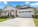 Charming home with a two-car garage and a well-manicured lawn at 9077 Myrna Dr, Gastonia, NC 28056