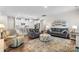 Bright and open living room with hardwood floors and comfortable seating at 9077 Myrna Dr, Gastonia, NC 28056