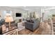 Comfortable living room with a media center and views of the backyard at 9077 Myrna Dr, Gastonia, NC 28056