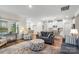 Cozy living room open to kitchen and dining area with lots of natural light at 9077 Myrna Dr, Gastonia, NC 28056