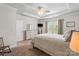 This main bedroom offers natural light, carpet flooring, tray ceilings, and neutral paint at 9077 Myrna Dr, Gastonia, NC 28056