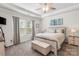 Serene main bedroom featuring a tray ceiling, a ceiling fan, and neutral decor at 9077 Myrna Dr, Gastonia, NC 28056