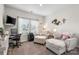 Comfortable office space with plush seating, a desk, and ample natural light from the large window at 9077 Myrna Dr, Gastonia, NC 28056