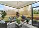 Screened patio with comfortable seating, rug, and view of the outdoors at 9077 Myrna Dr, Gastonia, NC 28056