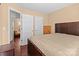 Bedroom with a bed and wooden furniture, multiple closets and entryways at 909 Jordans Pond Ln, Charlotte, NC 28214