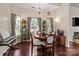 Charming dining room features a chandelier, round table, and lots of natural light at 909 Jordans Pond Ln, Charlotte, NC 28214