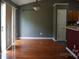 Dining area with hardwood floors, chandelier, sliding glass doors, and access to the kitchen at 9109 Foggy Meadow Rd, Charlotte, NC 28269