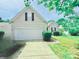 Charming one-story home with a well-maintained lawn and a two-car garage at 9109 Foggy Meadow Rd, Charlotte, NC 28269
